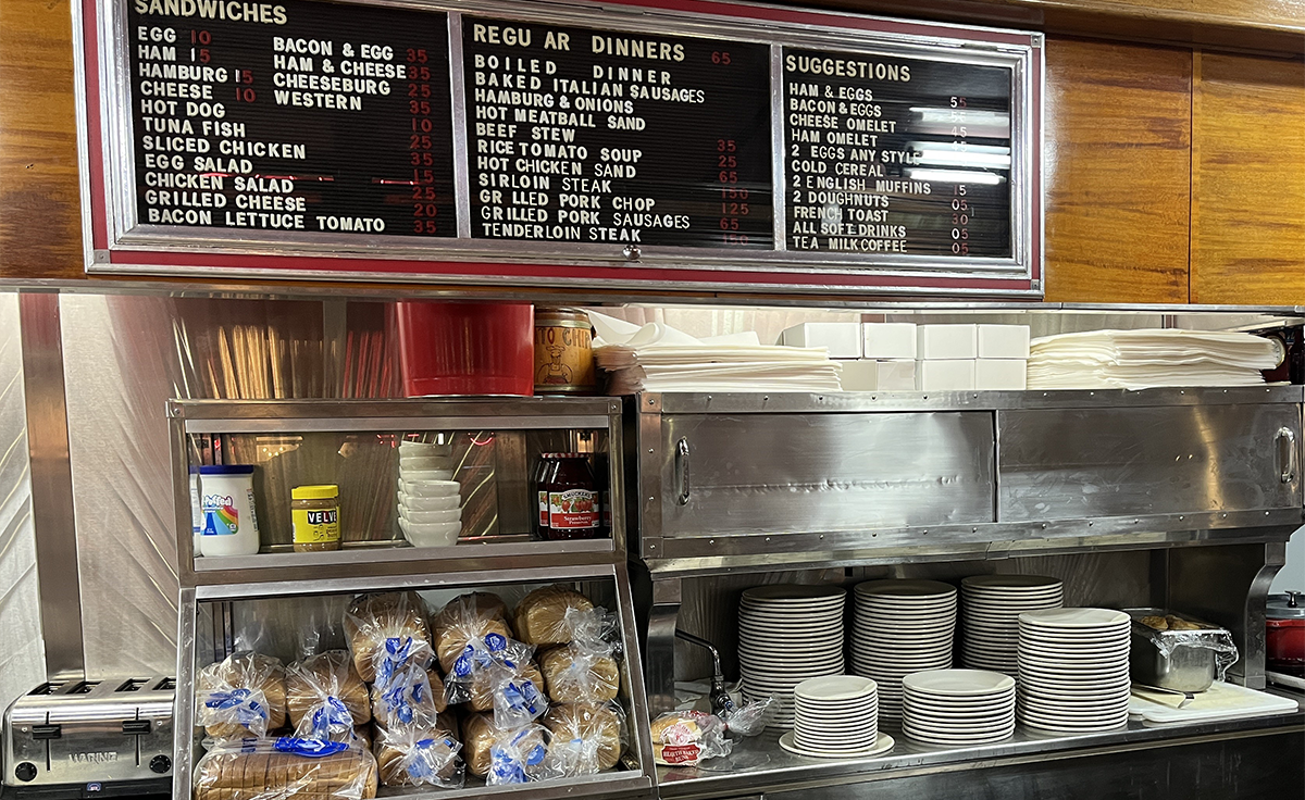 Stacks of plates, saucers, and bowls at the ready for guests at Lamy’s Diner in Henry Ford Museum