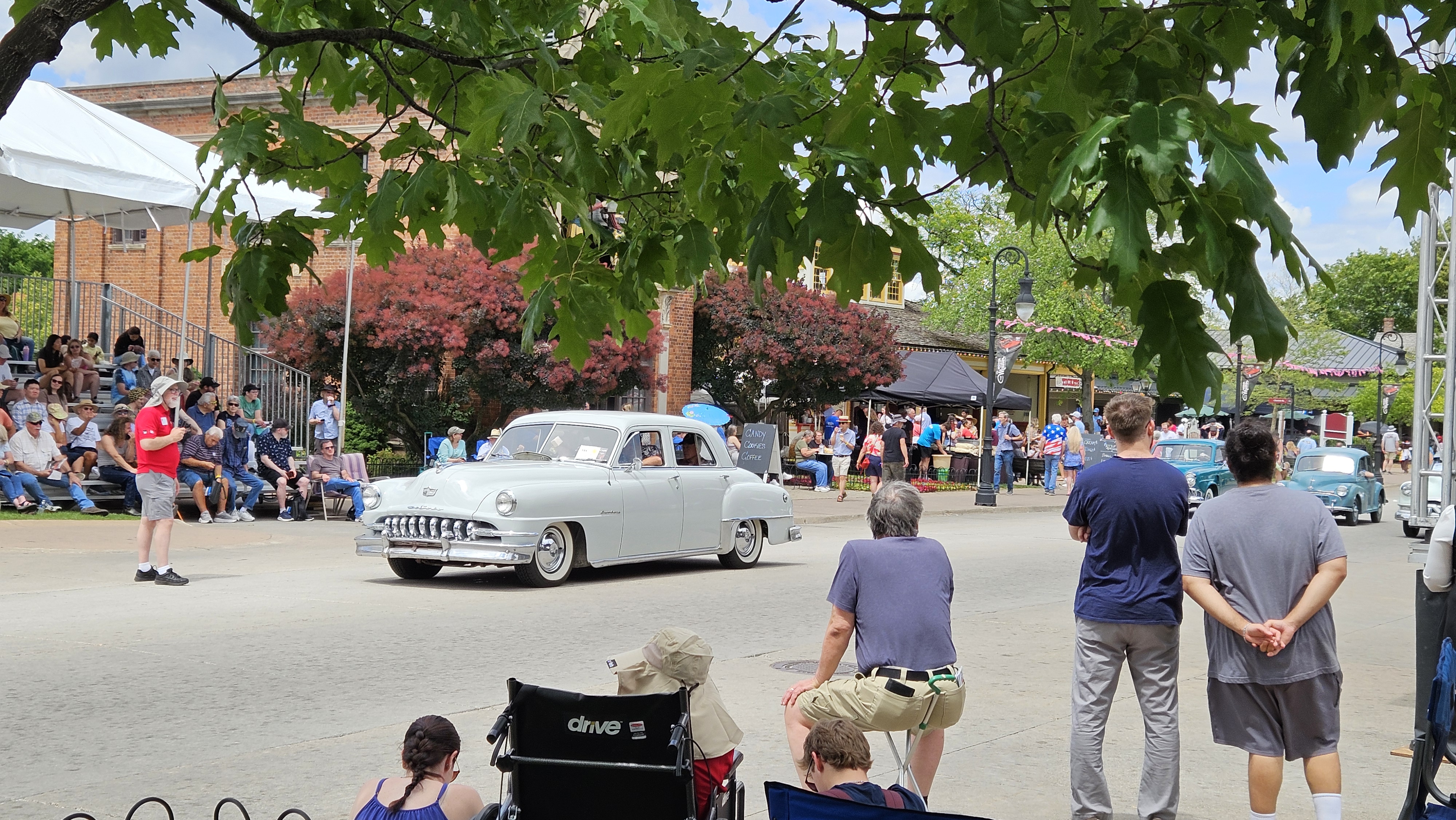 A 1951 DeSoto Custom participating in a pass-in-review vehicle presentation during Motor Muster 2026 at Greenfield Village.