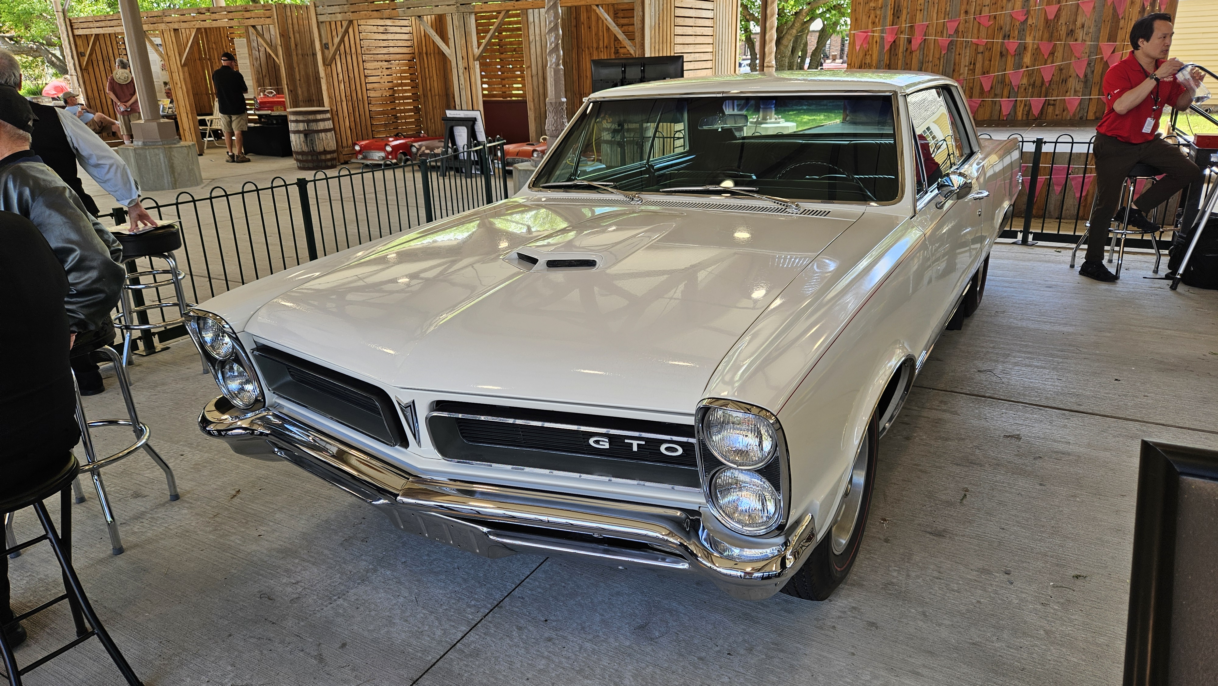 The Henry Ford’s Pontiac GTO displayed as the centerpiece of a 1965 vehicle exhibit in Detroit Central Market during Motor Muster 2026.