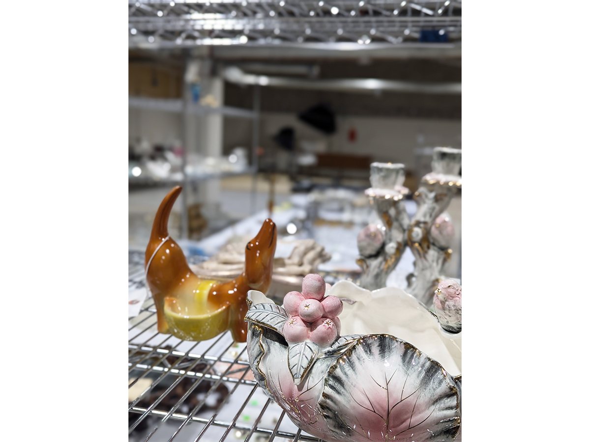 Carts are used to assist in relocating artifacts between stages of processing for The Jackson Home Project. A. L. Hirsch Rover Pottery Dachshund Ceramic Dresser Caddy and United China and Glass Company Pink and White Berries and Bird Leaf bowl are shown being relocated on a cart. / Photograph by Staff of The Henry Ford.