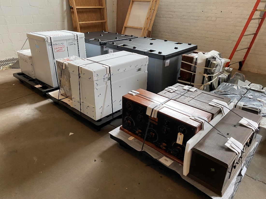 Boxes and objects strapped onto pallets
