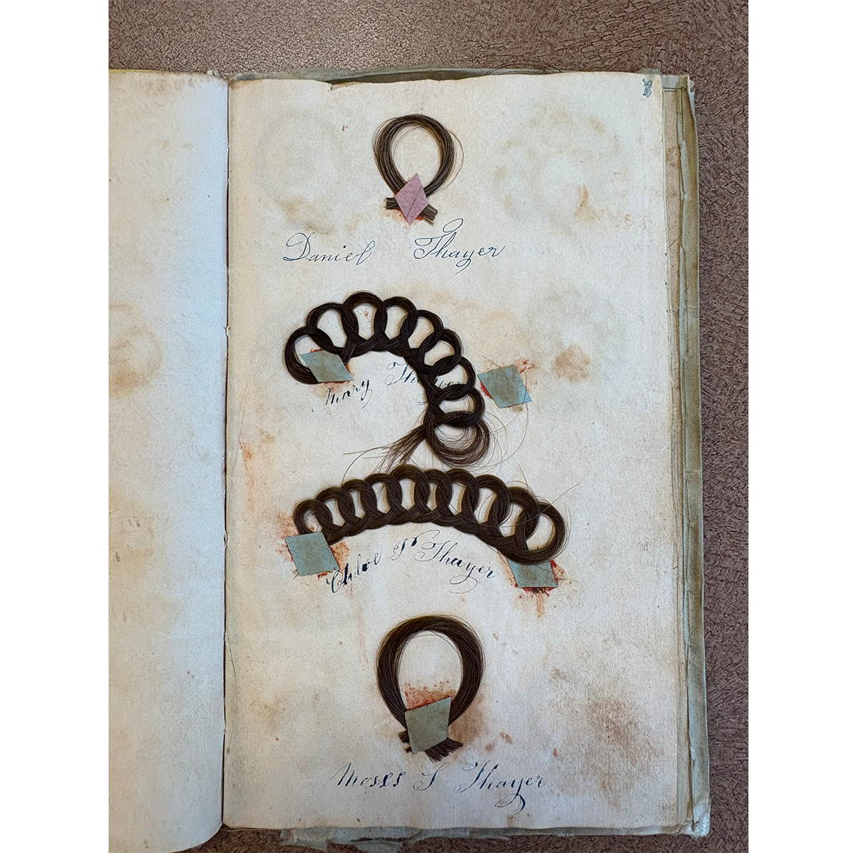 Pages from Thayer album showing simple hair loops, Acc. 56.40.1 / Photo by Staff of The Henry Ford 