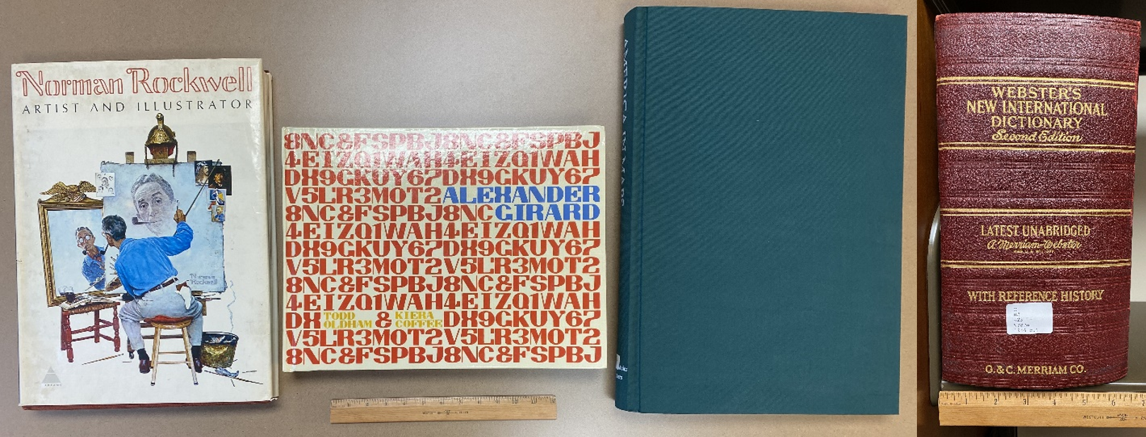 a collection of 4 books, laid side by side
