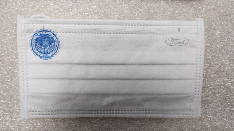 Single-Use Face Mask Manufactured for the Inaugural Ceremonies on January 20, 2021 White face mask with blue presidential insignia in one top corner and blue oval