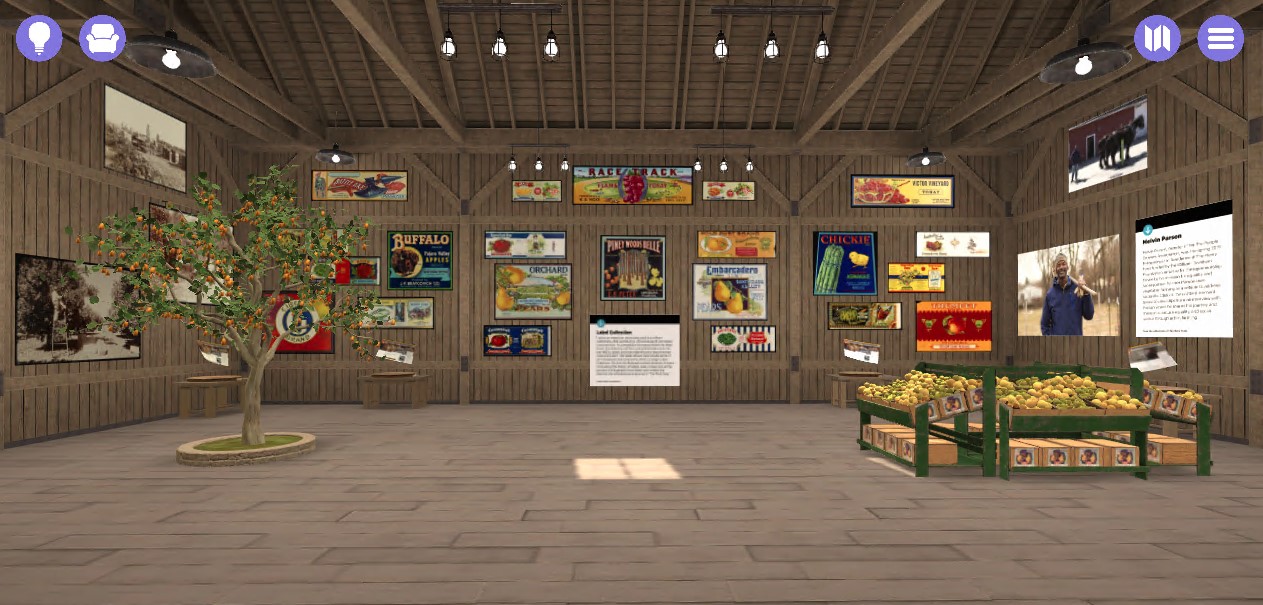 Virtual barn-like space with many colorful images on the walls, with fruit tree & crates as well