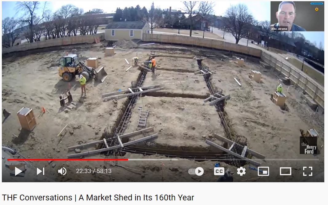 Video screenshot showing a construction site; small 
