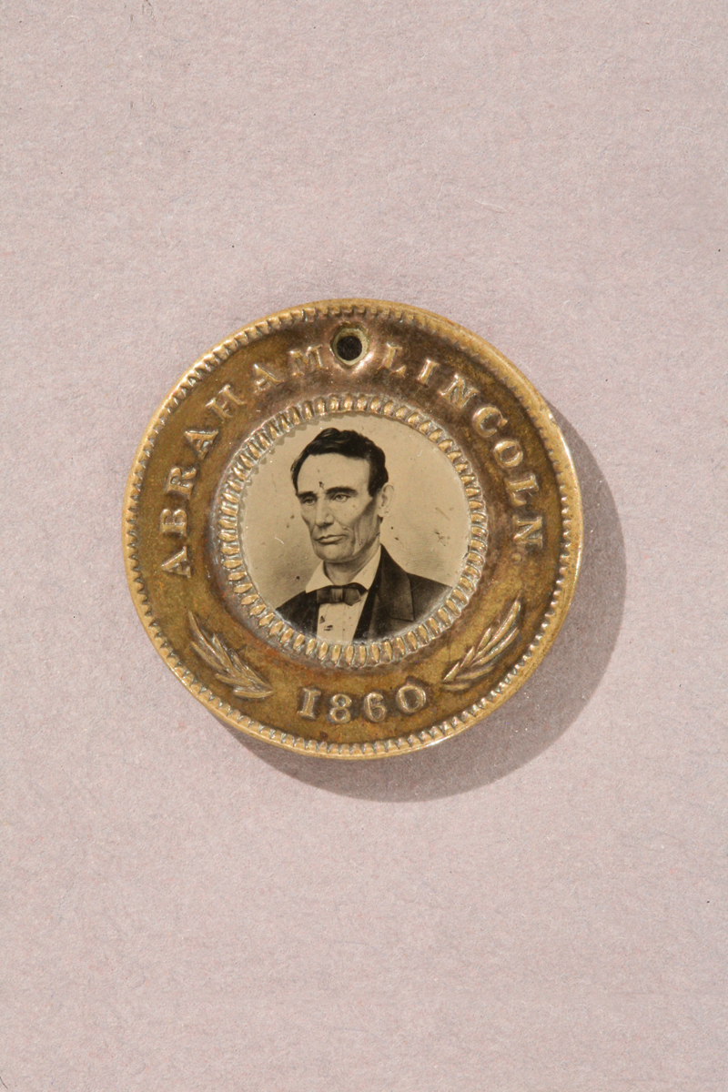 Gold colored button with text 