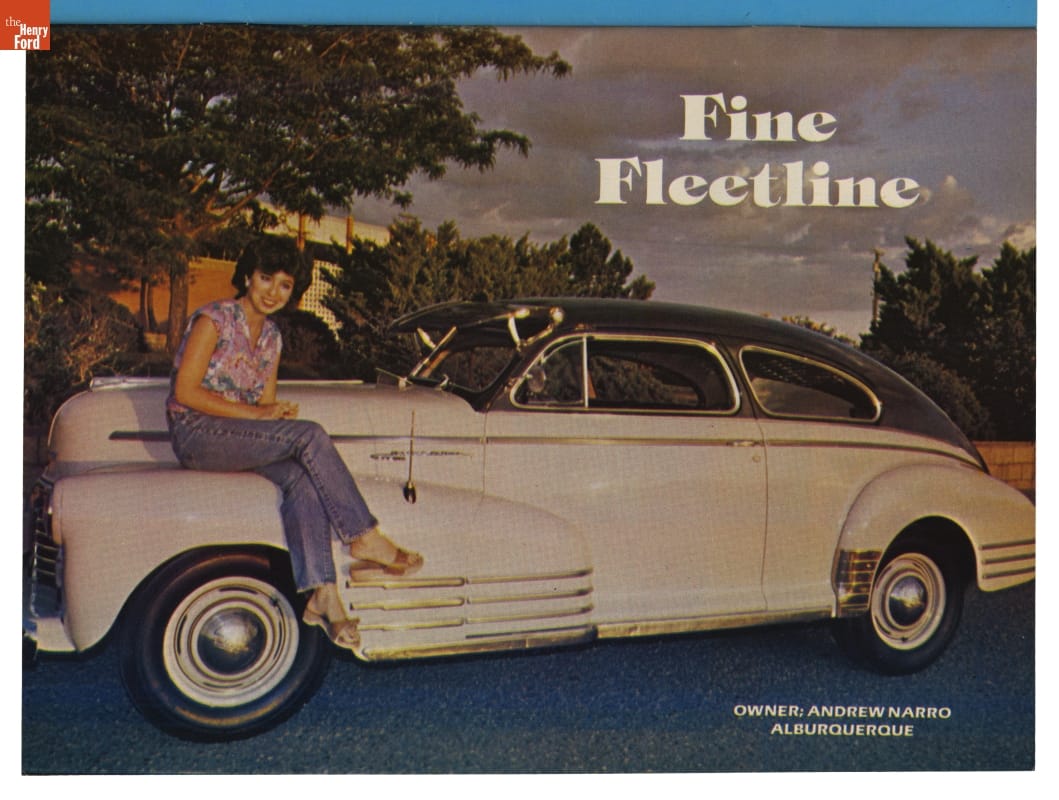 Technical Low Rider Magazine, 1981 / page 57 Woman sits on fender of large, bulbous white car with gray top