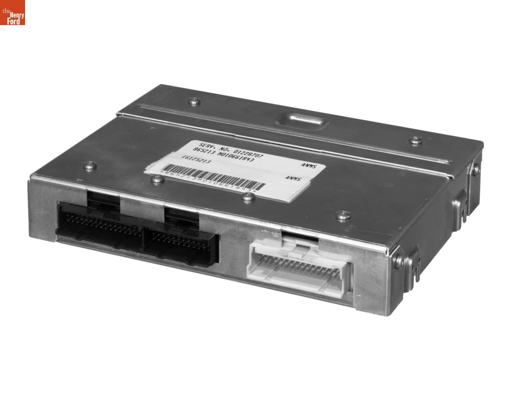 Metal box with label with text on top and connection ports on back