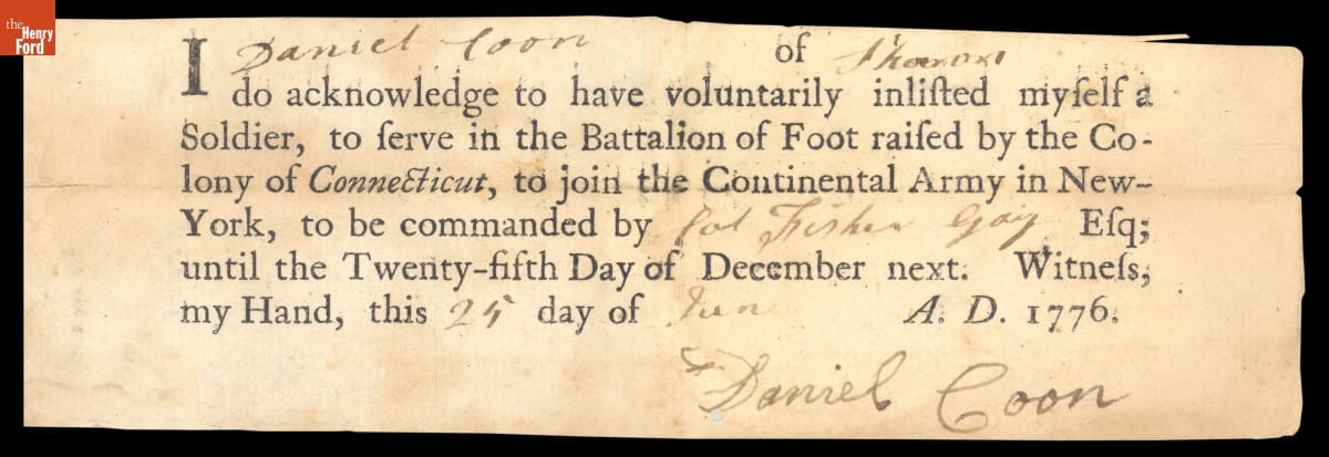 Scrap of paper with printed and hand-written cursive text