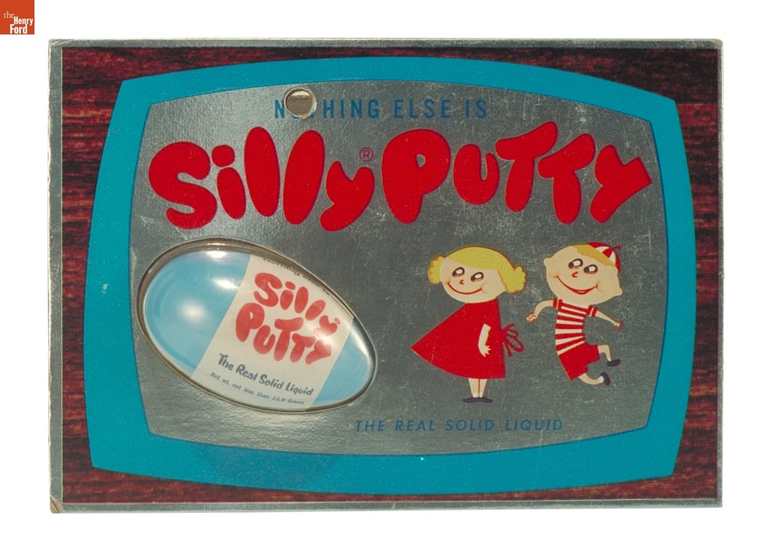 Plastic blister pack containing blue plastic egg with red and white label 