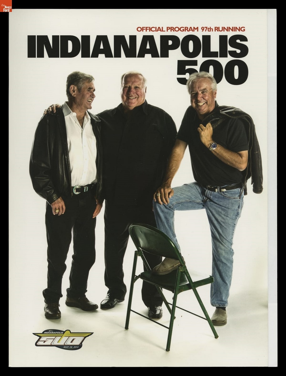 Program, Page with text and photo of three standing men, one with foot up on a folding chair