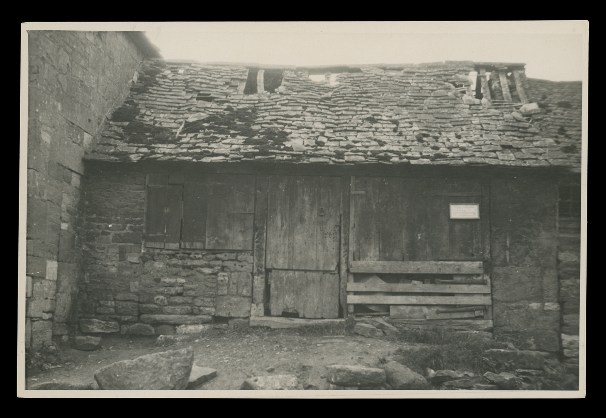 Run-down looking stone and wood building