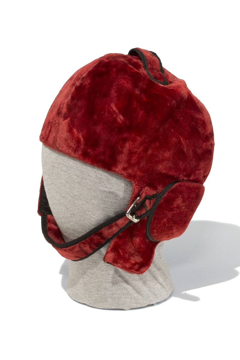 Helmet Used by George Robertson in 1908 Vanderbilt Cup Race Red velvet helmet with chin strap and buckle
