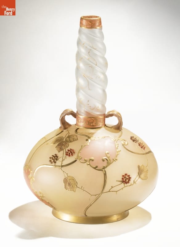 Glass vase with gold body with floral pattern and twisted white neck