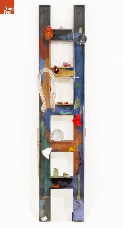 Colorful ladder with various shapes and items attached