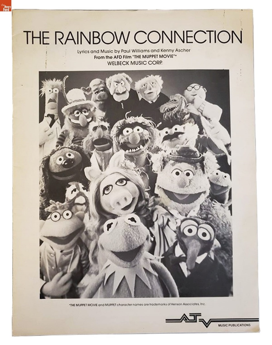 Page with black-and-white photo of about 18 Muppets; also contains text