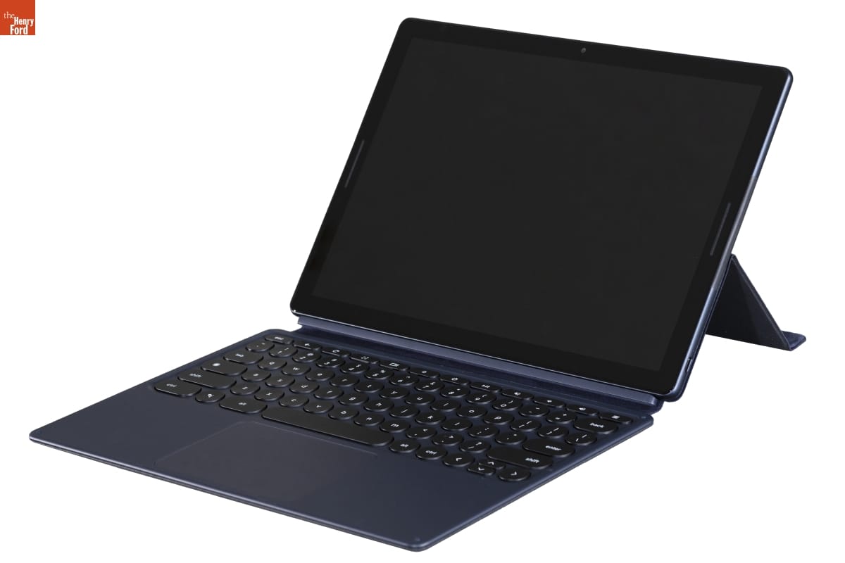 Tablet computer with keyboard and monitor propped up on stand
