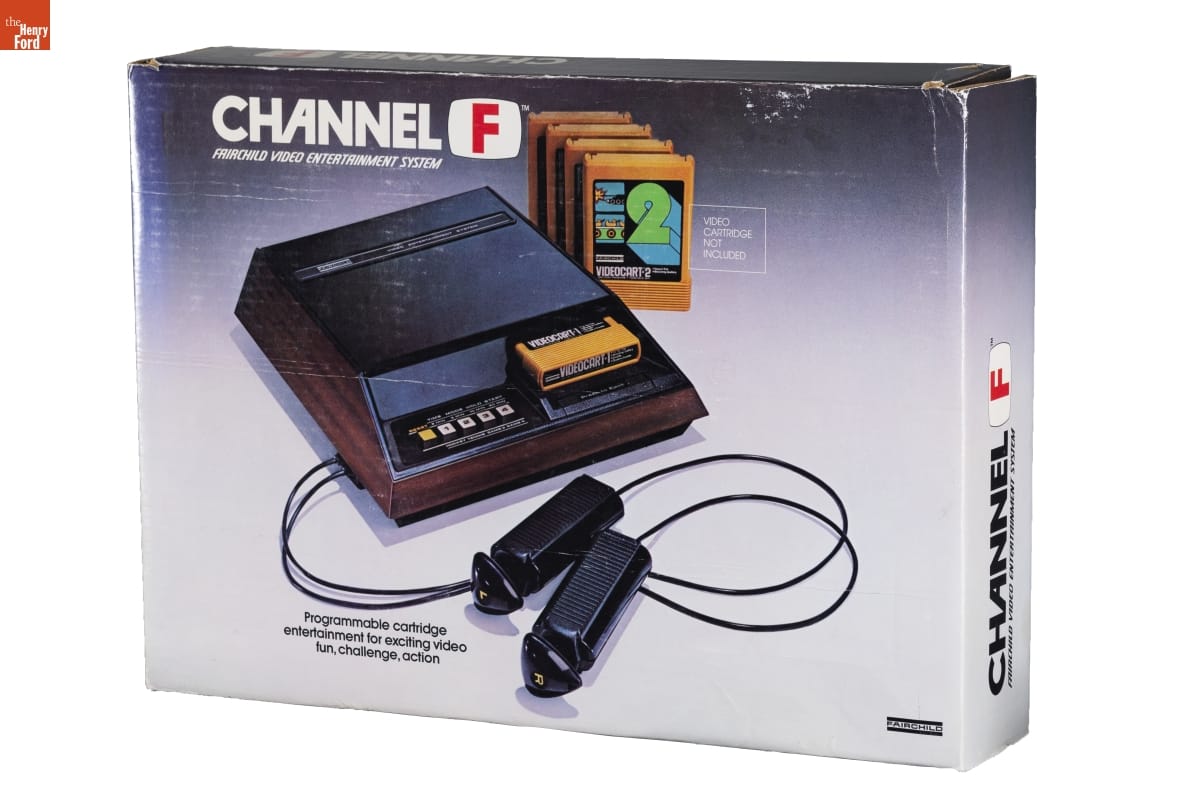 Box with image of boxy video game system, cartridges, and stick controllers, along with text
