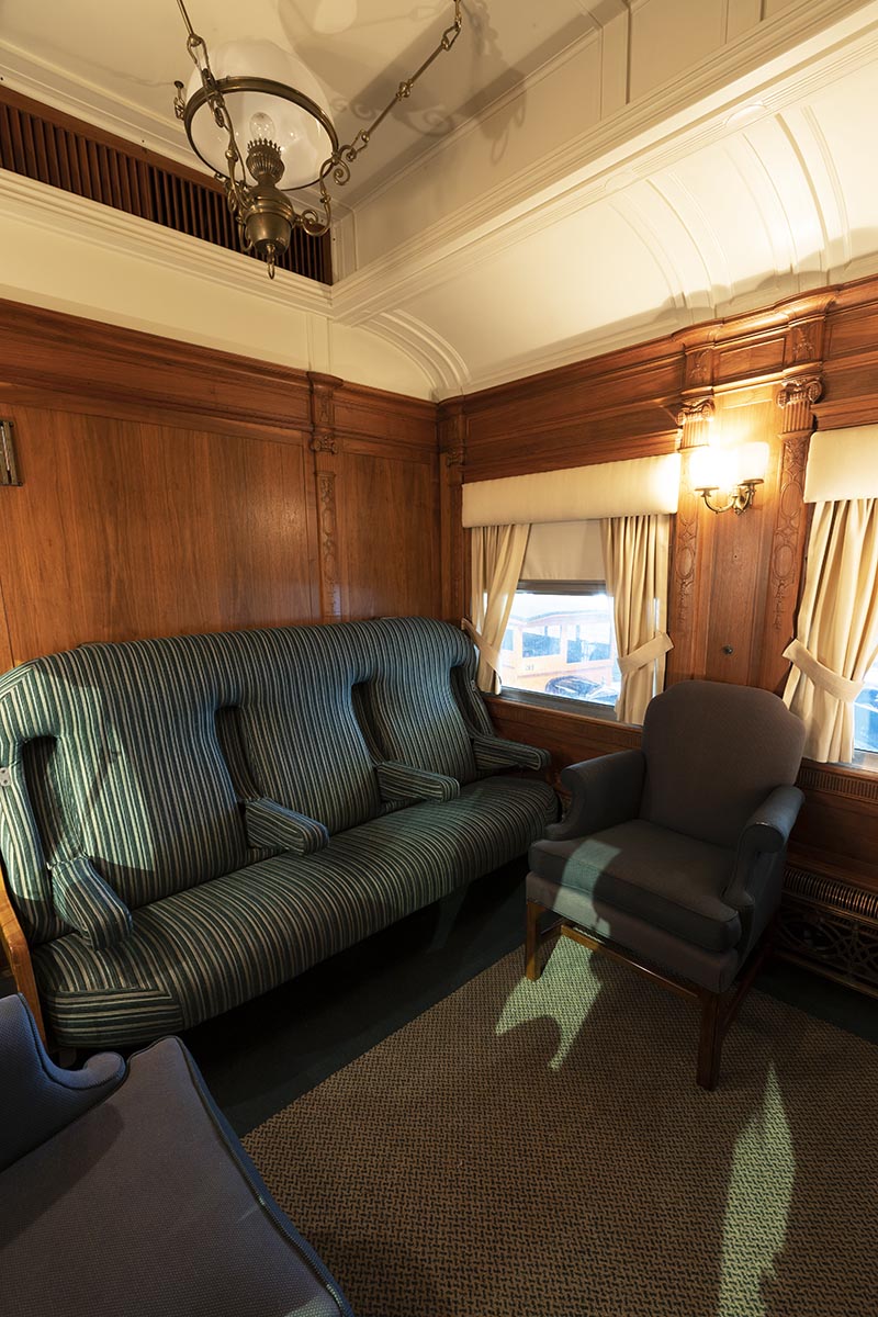Interior space with blue upholstered furniture and wood paneling