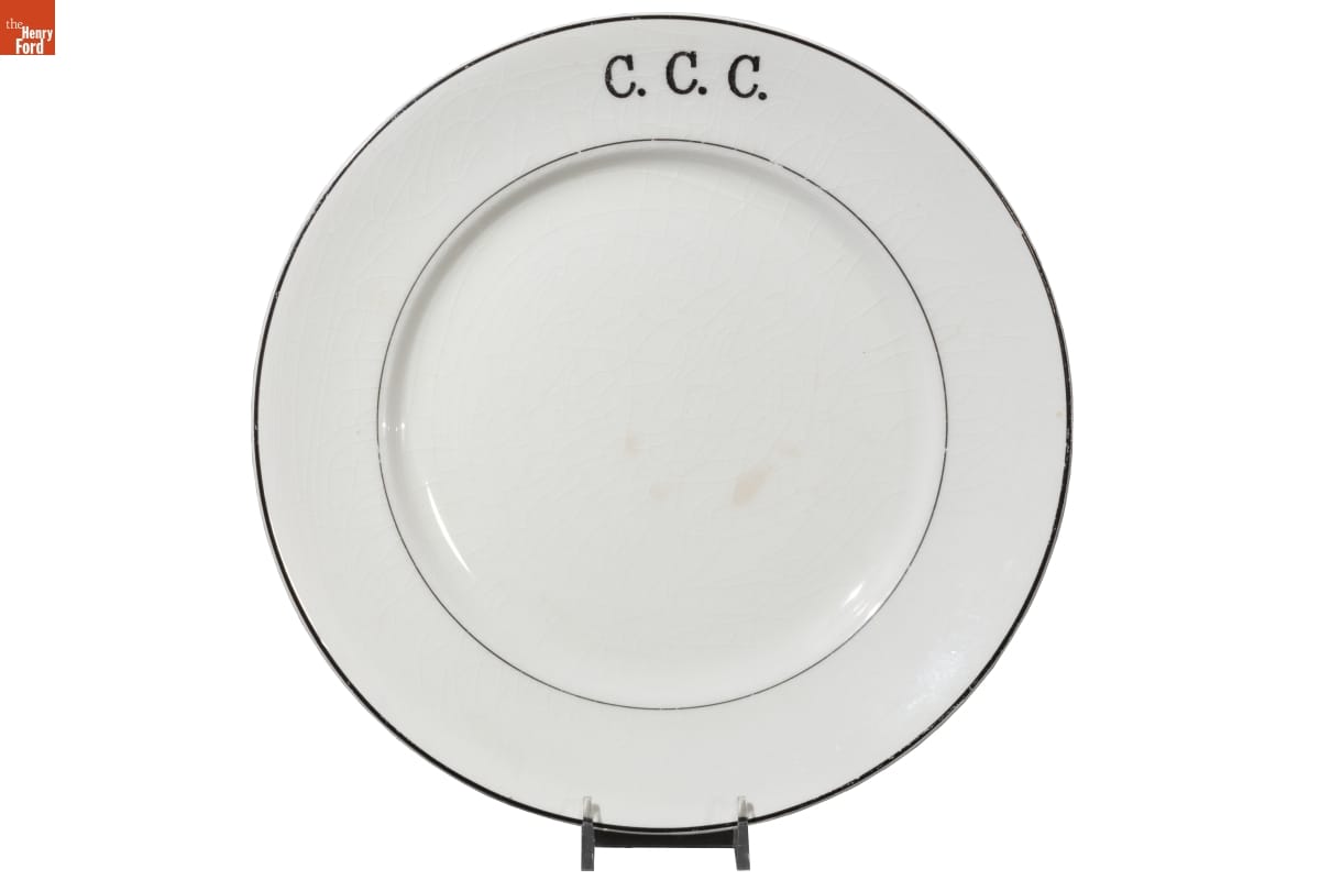 White plate with blue edge and blue internal ring and text 