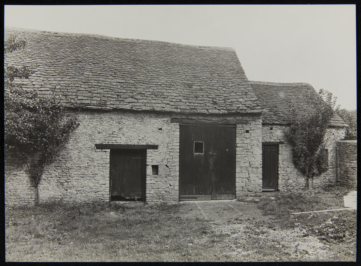 Stone building with several wooden doors