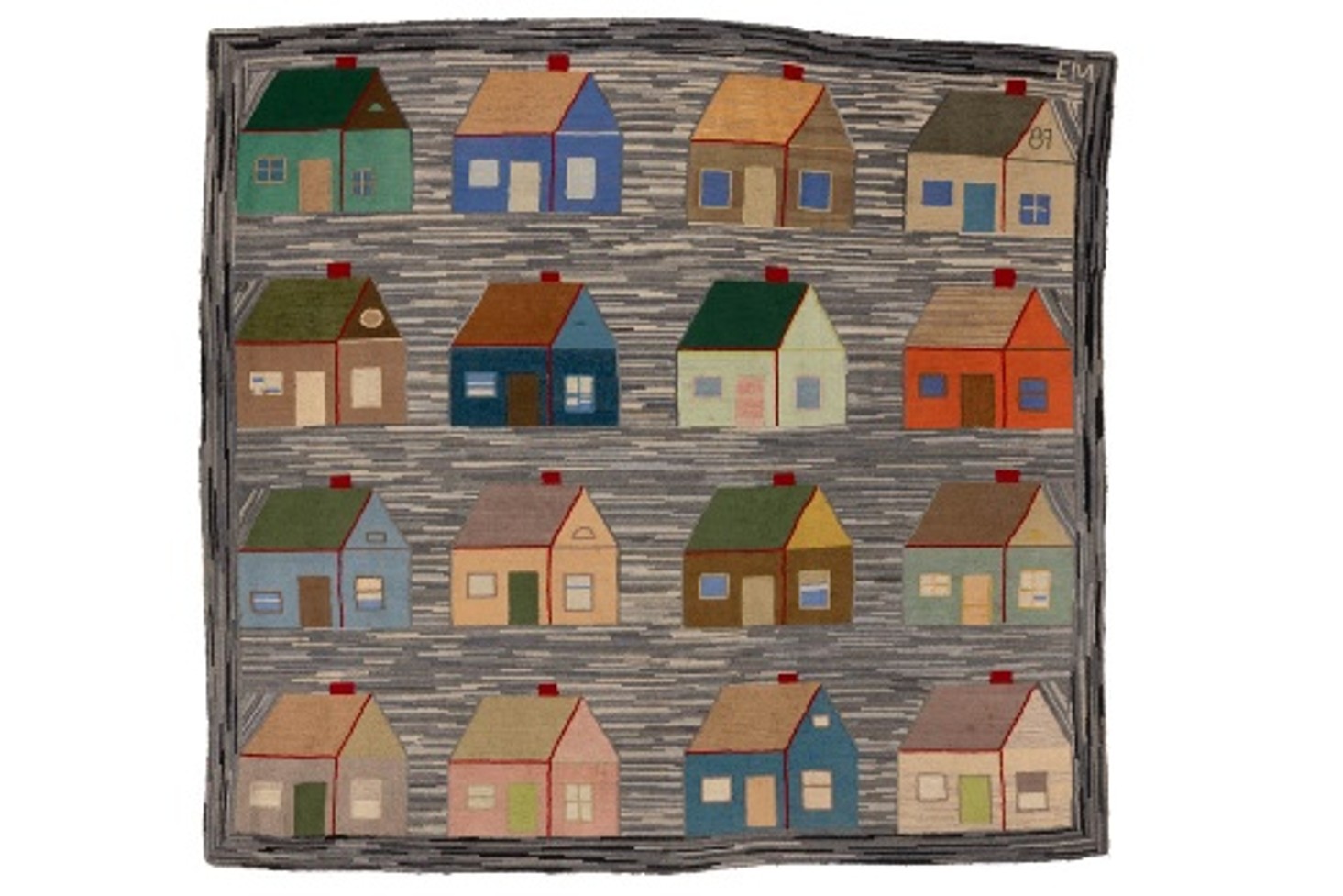 A hooked rug featuring several colorful houses