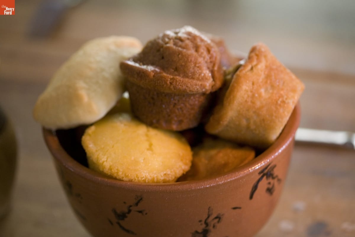 Eagle Tavern in Greenfield Village, October 2007 / Photographed by Michelle Andonian Red pottery bowl containing a variety of muffins and bread rolls