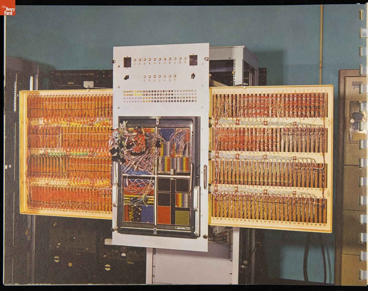 Metal panels covered in complex, multicolored wiring