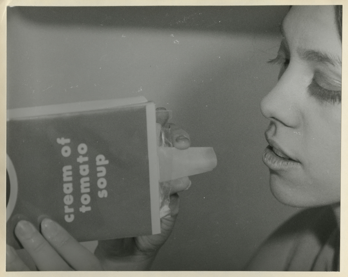 Report, Woman holds box labeled