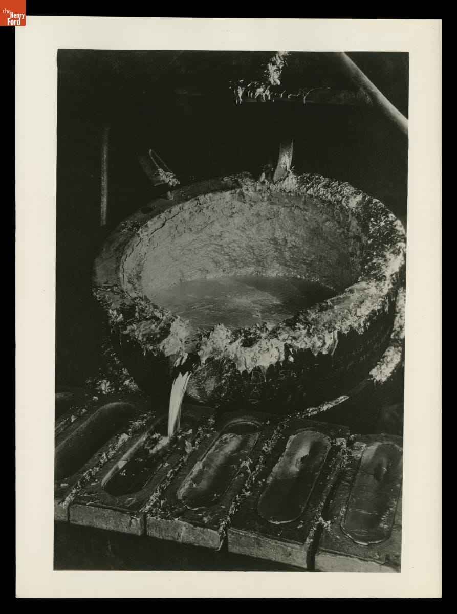 Pouring molten aluminum into ingot molds. Photographed by Margaret Bourke-White for Aluminum Company of America (Alcoa) and featured in Aluminum Company of America’s Century of Progress International Exposition Display, 1934.