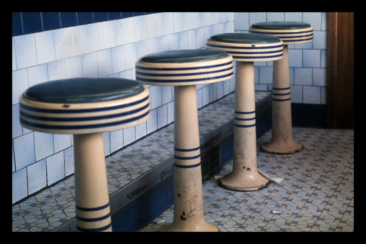 Original 1938 porcelain enamel stools in Silver Top Diner, Providence, RI, 1973. Photograph by Dick Gutman.