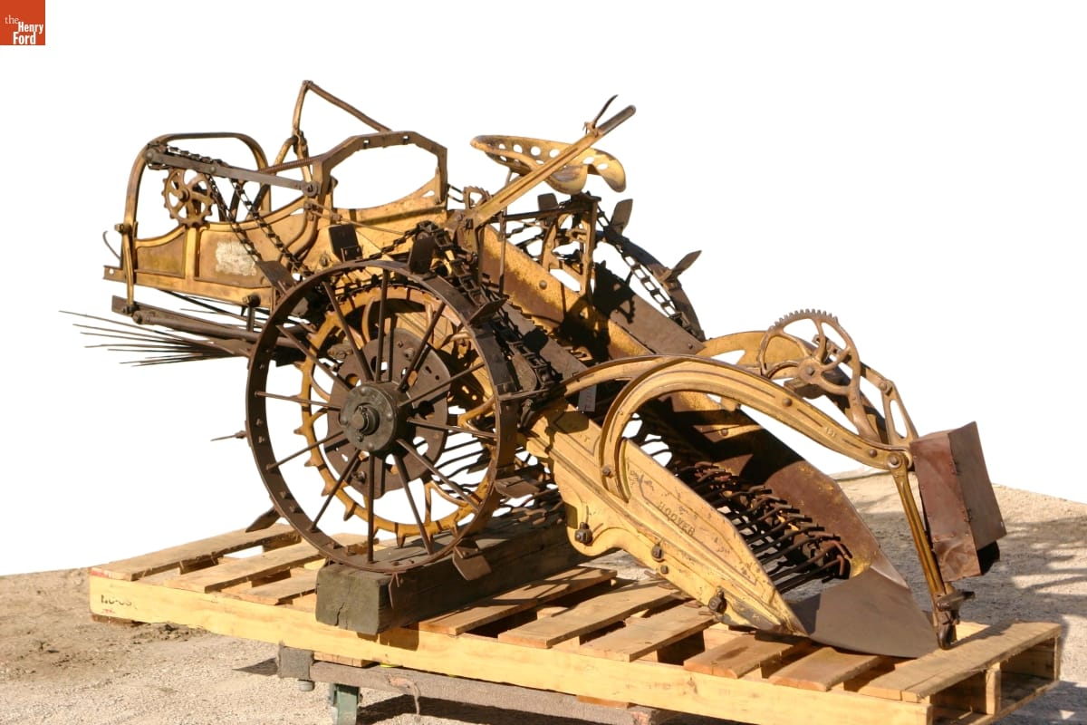 Machinery with wheels, gears, and what appears to be a conveyor belt